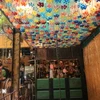 Plastic bottles arranged to create a beautiful ceiling lighting system. (Photo: VNA)