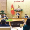 Prime Minister Pham Minh Chinh addresses the Government’s monthly regular meeting on December 7. (Photo: VNA)