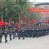 The cyber warfare unit participates in a parade on the street. (Photo: VNA)