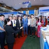 Deputy Minister of Health Tran Van Thuan (front row, 4th from right) visit the Vietnam Medi-Pharm 2024 in Hanoi on May 9. (Photo: VNA)