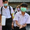 Washing hands before entering class at a school in Bangkok, Thailand. (Photo archive: AFP/VNA)