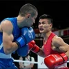 Nguyen Van Duong (R), who competed in the 2020 Tokyo Olympics, is a prominent member of the Vietnamese squad. (Photo: VNA)
