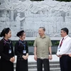 President To Lam (3rd from right) meets with ethnic people in Cao Bang province on June 9, standing before the bas-relief of 34 soldiers of the Propaganda Unit of the Liberation Army in Tran Hung Dao Forest, a special national relic in Tam Kim commune of Nguyen Binh district. (Photo: VNA)