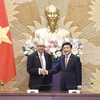 General Secretary of the National Assembly (NA) and Chairman of the NA Office Bui Van Cuong (R) and Secretary General of the House of Representatives of Morocco Najib El Khadi at their talsk in Hanoi on June 21. (Photo: VNA)