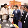 A business in Ho Chi Minh City introduces products to Indian firms at the conference (Photo: VNA)