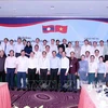 HCM City and Lao participants of the meeting pose for a group photo (Source: VNA)