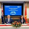 Vu Thi Chan Phuong, Chair of the SSC, (right) and ASIC Chairman Joseph Longo at the signing ceremony in Australia. (Photo courtesy of SSC) 