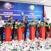 At the symbolic ribbon-cutting ceremony to inaugurate disaster data and communication lab in Vientiane on August 6. (Photo: VNA)