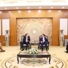 Politburo member, Secretary of the Party Central Committee and Chairman of its Commission for Information and Education Nguyen Trong Nghia (centre, right) and US Ambassador Marc Knapper at their meeting in Hanoi on August 7 morning. (Photo: VNA)