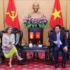 Politburo member, President of the Ho Chi Minh National Academy of Politics (HCMA) Nguyen Xuan Thang (R) and new Spanish Ambassador to Vietnam Carmen Cano de Lasala at their meeting in Hanoi on August 29. (Photo: VNA)