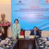 At the event announcing the implementation of support measures for Vietnamese citizens under the programme. (Photo: VNA)