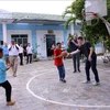 A basketball match with the children cared at the centre takes place as part of the visit. (Photo: VNA)