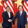 National Assembly Chairman Tran Thanh Man (R) and Speaker of the Malaysian House of Representatives Tan Sri Dato' Johari Bin Abdul. (Photo: VNA)