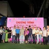 Lao and Cambodian students studying in Ho Chi Minh City and Vietnamese families hosting them pose for a group photo at the event. (Photo: VNA)