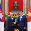 State President Luong Cuong (R) and visiting Cambodian King Preah Bat Samdech Preah Boromneath Norodom Sihamoni in Hanoi on November 28. (Photo: VNA)