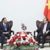 El viceprimer ministro Tran Luu Quang y el subdirector de la Comisión Estatal de Asuntos Étnicos de China, Bianba Zhaxi. (Fuente: VNA)