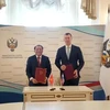 El ministro vietnamita de Cultura, Deportes y Turismo, Nguyen Van Hung (i), y el ministro ruso de Deportes, Mijaíl Vladimirovich Degtyarev, firmaron un memorando de entendimiento sobre cooperación en el deporte durante su reunión en Moscú. (Foto: VNA)