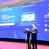 Deputy Minister of Industry and Trade Nguyen Sinh Nhat Tan addresses the National Brand Forum held by the Ministry of Industry and Trade in Hanoi on April 16 (Photo: VietnamPlus)