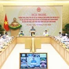 Prime Minister Pham Minh Chinh chairs an online conference of permanent Government members with representatives of localities affected by Typhoon Yagi on September 15 morning. (Photo: VNA)