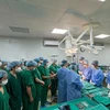 Before the surgery to take organs, the medical staff take a minute of silence to express gratitude, and say goodbye to the young donor. (Photo: VietnamPlus)