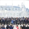 Party General Secretary and State President To Lam, French President Emmanuel Macron, heads of member countries of the International Organisation of La Francophonie and guests pose for a group photo (Photo: VNA)