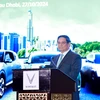 Prime Minister Pham Minh Chinh addresses the ceremony launching VinFast electric vehicles in the UAE (Photo; VNA) 