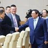 Le Premier ministre Pham Minh Chinh préside un séminaire avec des géants économiques chinois