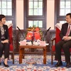 La directrice générale de la VNA, Vu Viet Trang, s'entretient à Pékin avec le président de l'agence de presse Xinhua, Fu Hua. Photo: VNA