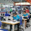 L'économie vietnamienne a connu une reprise positive après la pandémie, notamment en termes d'exportations et d'attraction d'investissements directs étrangers (IDE). Photo: VNA