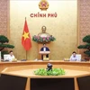 Prime Minister Pham Minh Chinh chairs the Government’s October regular meeting on November 9. (Photo: VNA)