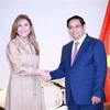 Vietnamese Prime Minister Pham Minh Chinh (R) receives Carolina Mejia, General Secretary of the ruling Modern Revolutionary Party (PRM) and Mayor of Santo Domingo. (Photo: VNA)