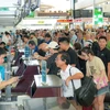 Passengers at the Noi Bai International Airport. (Photo: VNA)