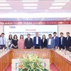 VNA and CCJ representatives at the meeting in Hanoi on May 15. (Photo: VNA)