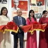 Vietnamese Ambassador to France Dinh Toan Thang (third from left) and other delegates cut ribbon to launch the exhibition (Photo: VNA)