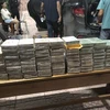 The 100 bars of heroin seized by border guards. (Photo: VNA)