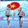 Bui Thi Ngan (right) and teammate Nguyen Thi Thu Ha seen celebrating when they won top two places at the 32nd SEA Games' 800m event. Ngan takes gold in the women's 1,500m at the 2024 Taiwan Athletics Open on June 1. (Photo: VNA)
