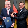 Minister-President of the State of Hessen of Germany Boris Rhein (R) presents Order of Merit to