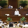 Auditor General of the State Audit Office of Vietnam Ngo Van Tuan (standing) answers deputies’ questions at the National Assembly (NA)'s 7th session on June 5 (Photo: VNA)