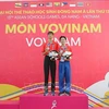 Two silver medalists of Vietnam at the 48-53.9kg sparring and men’s Five Gate Form performance events. (Photo: VNA)