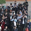 Reporters operate at the welcoming ceremony for General Secretary of the Communist Party of China and Chinese President Xi Jinping in Hanoi in December 2023 (Photo: VNA)