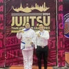 Jujitsu fighter Nguyen Thị Thanh Truc (left) and her coach pose for a photo after winning gold at the 2024 Thailand Open Grand Prix. (Photo of Thanh Truc)