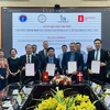 Delegates sign a Memorandum of Understanding on improving the quality of examinations and treatments of chronic diseases in Vietnam until 2026. (Photo: VNA)