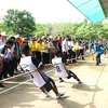 VRG workers compete in a tug-of-war game at the sports event in Cambodia’s Kampong Thom province. (Photo: VNA)