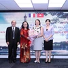Representatives from HUFO and the Vietnam - France Friendship Association of HCMC congratulate Consul General of France in Ho Chi Minh City Emmanuelle Pavillon-Grosser at the gathering. (Photo: VNA)