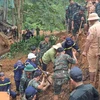 Rescuers search for victims buried by the landslide in Ha Giang province on July 13. (Photo: VNA)