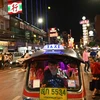 A tuk-tuk carrying tourists in the Chinatown area of Bangkok. (Photo: AFP) 