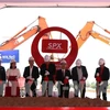 Authorities at the ground-breaking ceremony for an automated sorting centre of express delivery company SPX held on July 16 in Binh Duong province. (Photo: VNA)