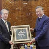 President To Lam (right) hosts a reception in Hanoi on July 17 for Chinese Ambassador to Vietnam Xiong Bo who came to say goodbye to the State leader at the end of his tenure. (Photo: VNA)