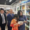 Deputy Minister of Foreign Affairs Le Thi Thu Hang, who is also Chairwoman of the State Committee for Overseas Vietnamese Affairs (COVA), attends the inauguration ceremony for the “Vietnamese bookcase” in Paris. (Photo: VNA)