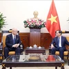 Minister of Foreign Affairs Bui Thanh Son (right) receives Special Advisor to the Japan - Vietnam Friendship Parliamentary Alliance Takebe Tsutomu in Hanoi on July 22. (Photo: VNA)